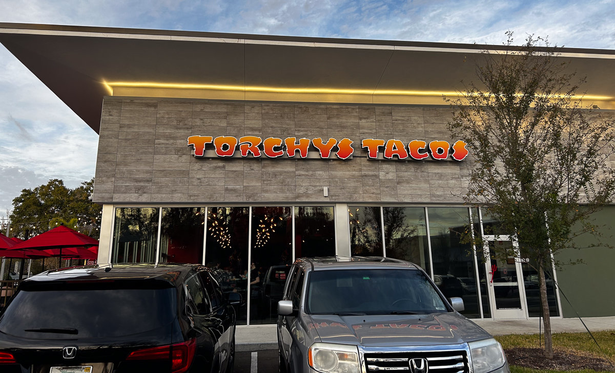 front of building with torchys tacos sign
